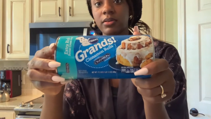 A Woman Holding a Pillsbury Cinnamon Rolls Package